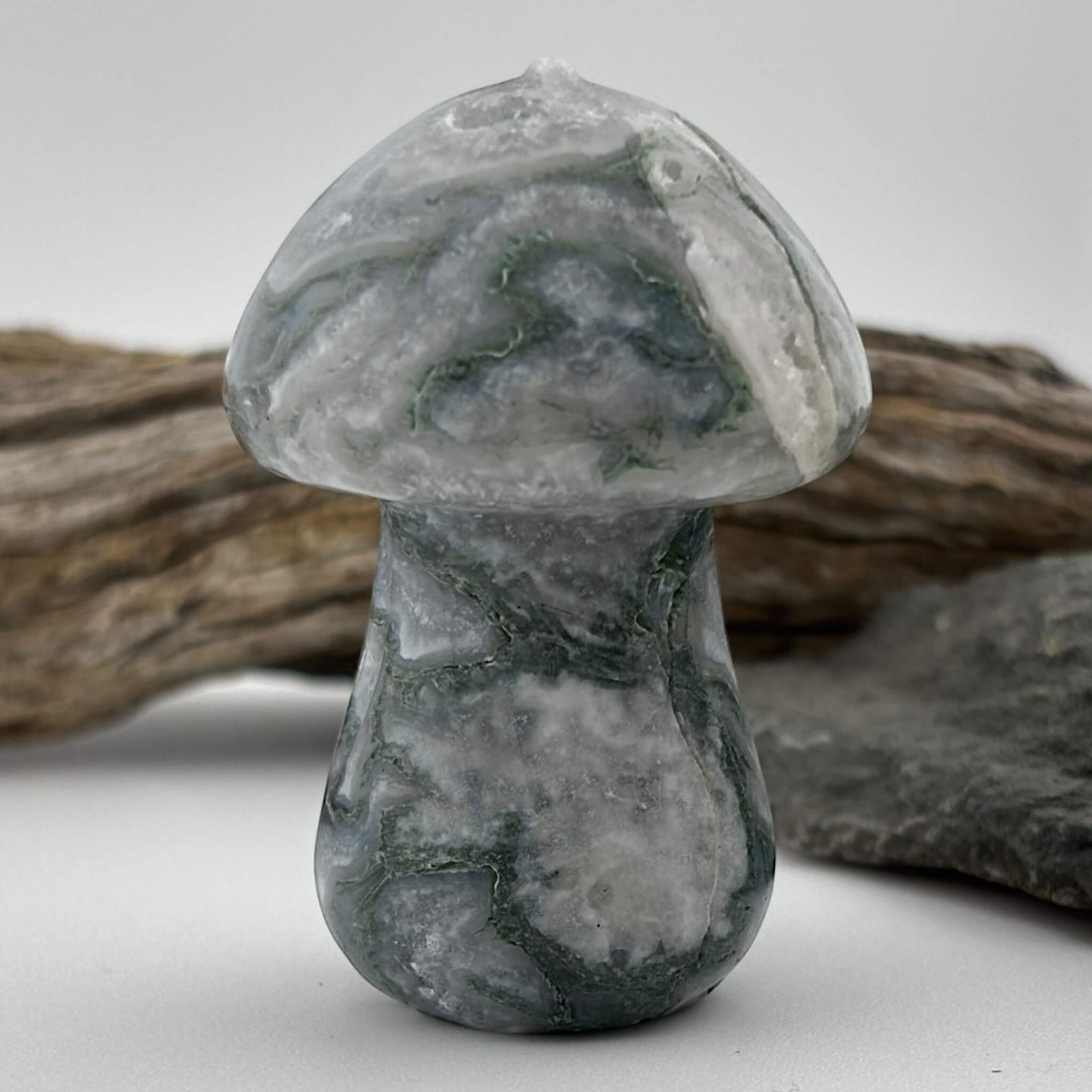 Marble mushroom sculpture on a neutral background