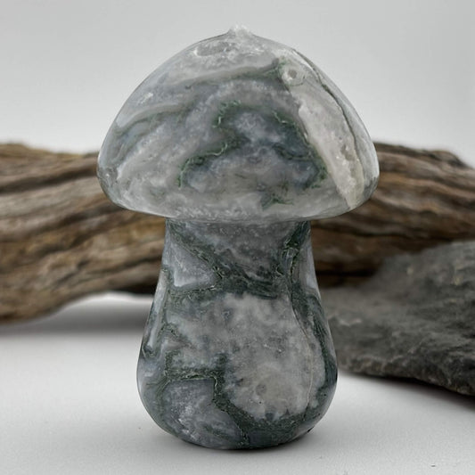 Marble mushroom sculpture on a neutral background