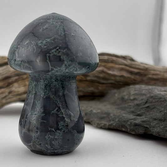 Decorative stone mushroom on a neutral background