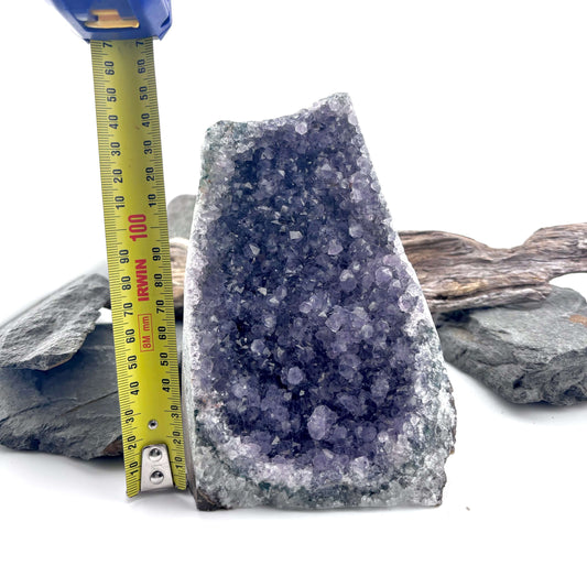 Amethyst crystal geode on a wooden surface