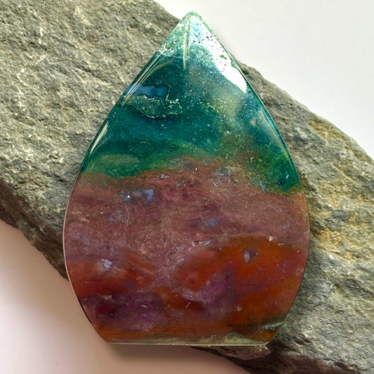 Ocean Jasper – Joy & Renewal
Known as the Stone of Optimism, Ocean Jasper showcases swirling patterns and vibrant hues that echo the beauty of the sea. It’s believed to uplift the spirit, promote emotional healing, and encourage a positive outlook on life. This stone is also said to nurture patience, enhance self-expression, and foster a deep sense of inner peace, making it a cherished ally for embracing change and finding joy in the present moment.