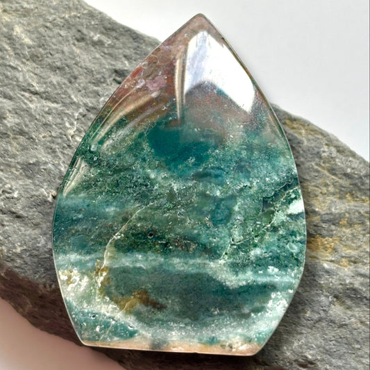 Ocean Jasper – Joy & Renewal
Known as the Stone of Optimism, Ocean Jasper showcases swirling patterns and vibrant hues that echo the beauty of the sea. It’s believed to uplift the spirit, promote emotional healing, and encourage a positive outlook on life. This stone is also said to nurture patience, enhance self-expression, and foster a deep sense of inner peace, making it a cherished ally for embracing change and finding joy in the present moment.