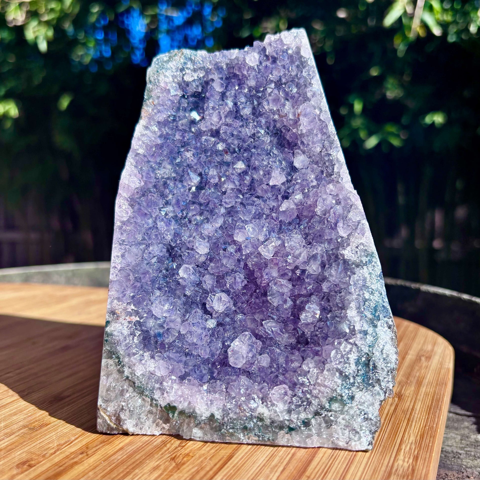 Amethyst crystal geode on a wooden surface 