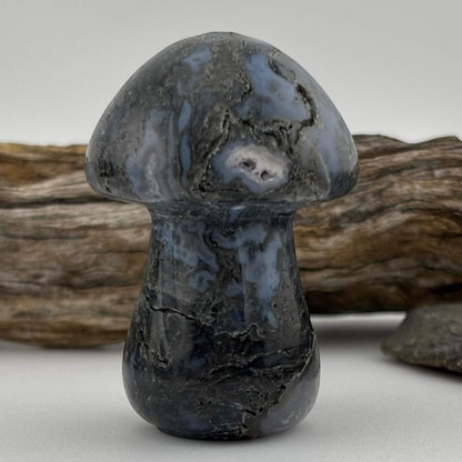 Decorative stone mushroom with a natural wood background