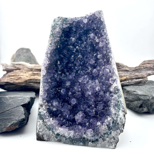 Amethyst crystal geode on a wooden surface 