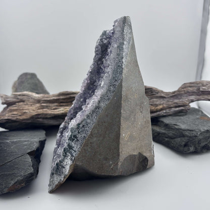 Amethyst crystal geode on a wooden surface 
