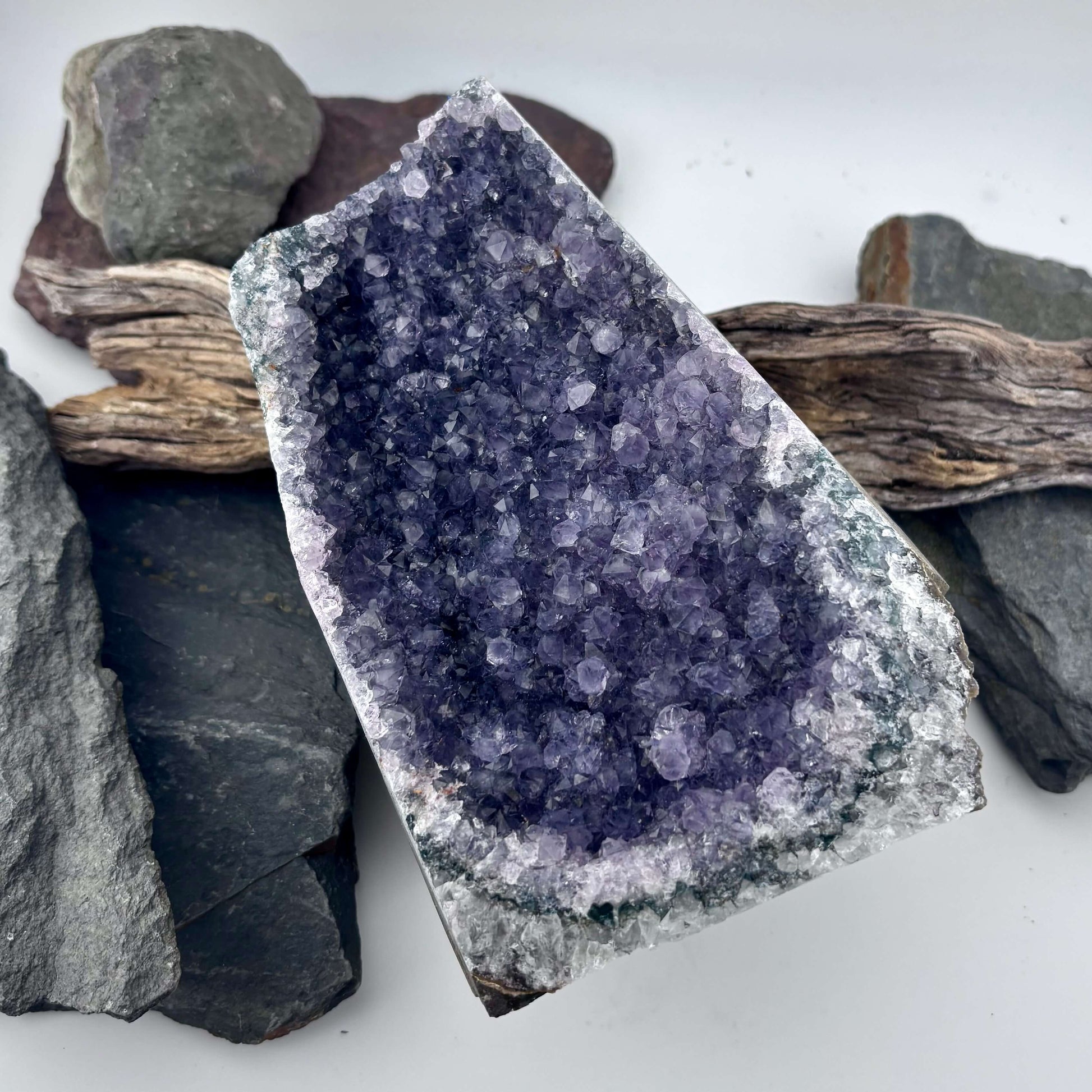 Amethyst crystal geode on a wooden surface 